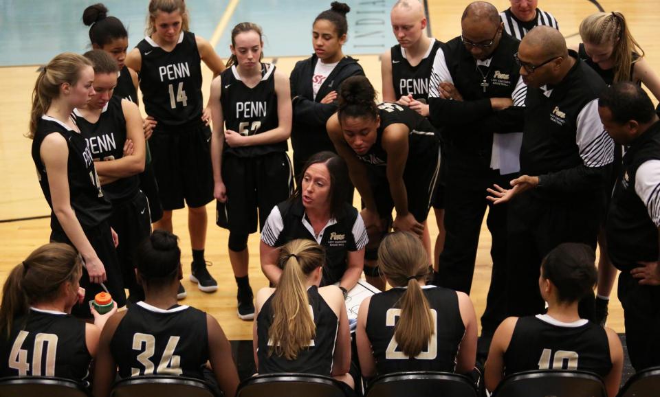 Penn Coach Kristi Ulrich with the Penn Girls Basketball team