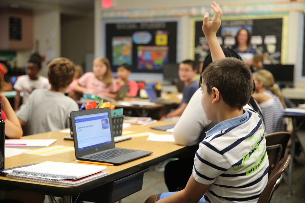 student raising his hand