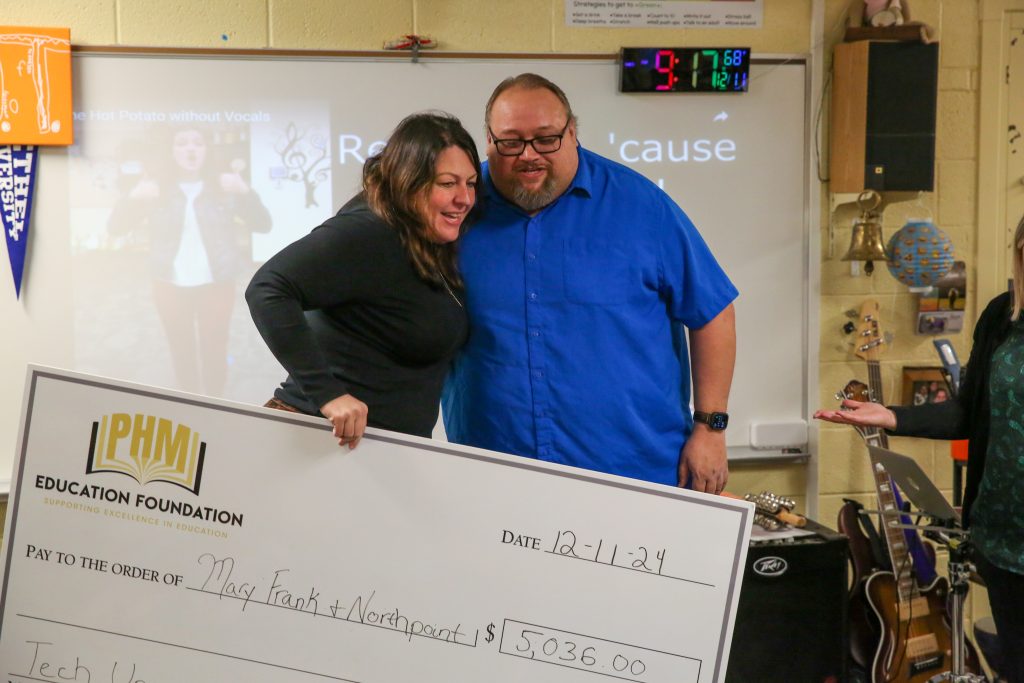 teacher receives check