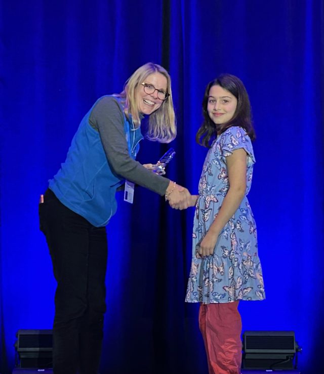 Student receiving award