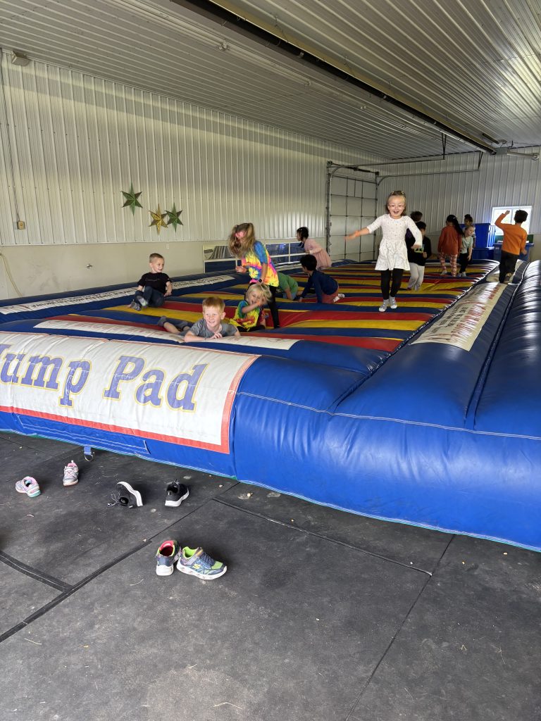 Children playing in an inflatable bounce house.